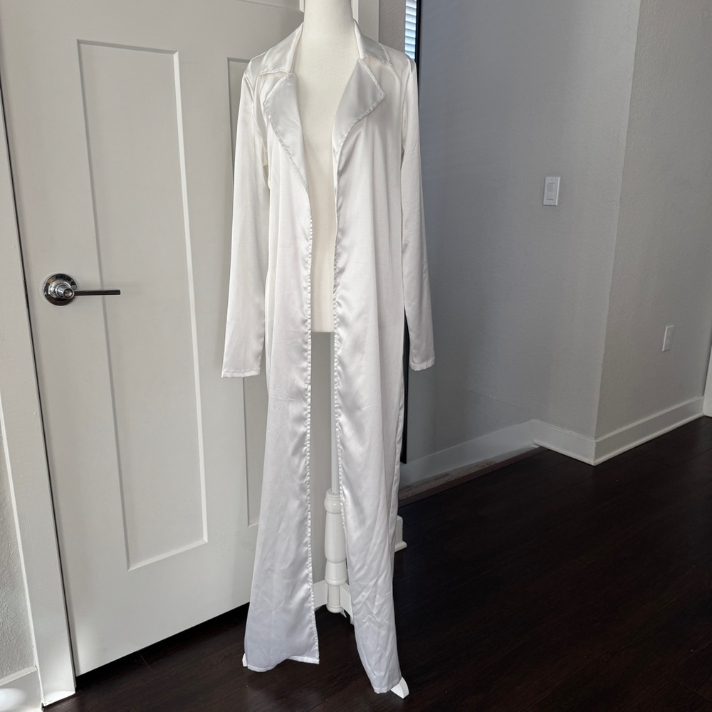 White satin long cardigan from Fashion Nova with a slit in the back.